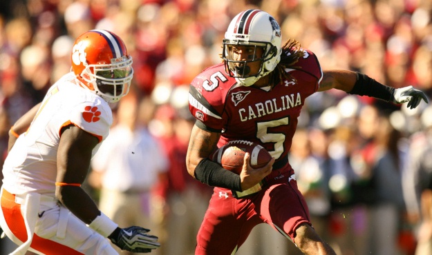 South Carolina's Stephon Gilmore gets around Clemson's Ricky Sapp during first-quarter action in Columbia, S.C. on Saturday, Nov. 28, 2009. The play was a part of a drive that led to a Gamecock touchdown. (Travis Bell/Sideline Carolina)