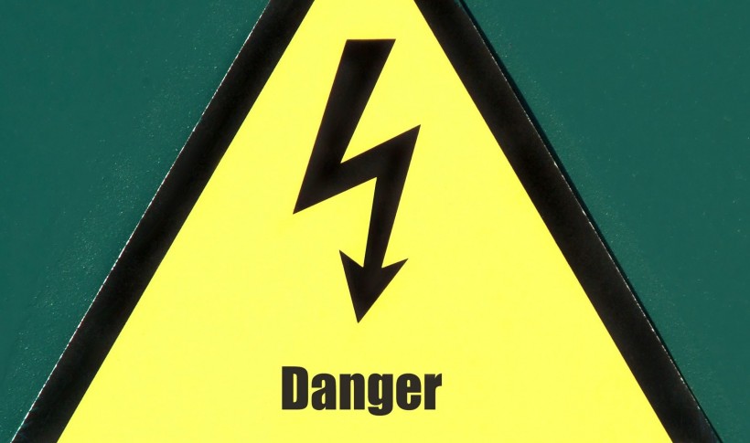 High voltage danger sign in fence of power plant